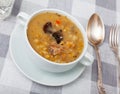 Thick pearl barley mushroom soup with pork and vegetables Royalty Free Stock Photo