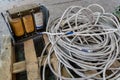 Thick powerful white cable and old transformer welding machine with copper winding