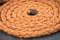 Thick rope coiled on deck of ship or yacht Royalty Free Stock Photo