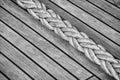 Thick rope on an old sailing ship wooden deck. Royalty Free Stock Photo