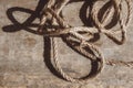 Thick rope on old wooden background. Top view. Copy, empty space for text Royalty Free Stock Photo