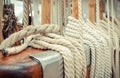 Thick ropes on sailboat. Part of yacht concept