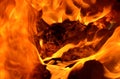 A thick, saturated flame from the burning of rubber and plastic. Royalty Free Stock Photo