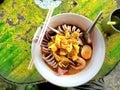 Thick seafood noodles consisting of squid noodles, boiled eggs, colorful and appetizing.