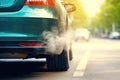 Thick smoke and exhaust gases emitted from the exhaust pipe of a green colored car. The problem of air pollution. Impact of cars Royalty Free Stock Photo