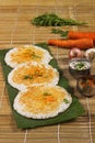 Thick spongy dosas served together with coconut chutney and sambhar