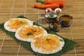 Thick spongy dosas served together with coconut chutney and sambhar