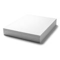 A thick stack of blank white paper sheets lying flat isolated on white background Royalty Free Stock Photo