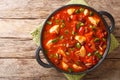 Thick tasty chicken stew with red beans in spicy chili sauce close-up in a pan. horizontall top view Royalty Free Stock Photo