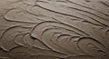 Thick, textured layers of brown substance are artfully spread across a surface, Royalty Free Stock Photo