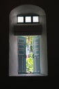 Thick walls as shown on side window of Mahatao church.