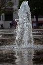 Thick water jet of a park fountain. Water splash, close up. Royalty Free Stock Photo