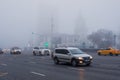 Thick white fog in Moscow. Cars on the Garden Ring. Russia. November 2021 Natural phenomenon. Smog. Royalty Free Stock Photo