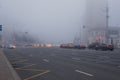 Thick white fog in Moscow. Cars on the Garden Ring. Russia. November 2021 Natural phenomenon. Smog. Royalty Free Stock Photo