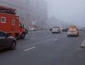 Thick white fog in Moscow. Cars on the Garden Ring. Russia. November 2021 Natural phenomenon. Smog. Royalty Free Stock Photo