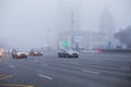 Thick white fog in Moscow. Cars on the Garden Ring. Russia. November 2021 Natural phenomenon. Smog. Royalty Free Stock Photo