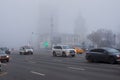 Thick white fog in Moscow. Cars on the Garden Ring. Russia. November 2021 Natural phenomenon. Smog. Royalty Free Stock Photo