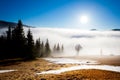 Thick white fog among mountain peaks Royalty Free Stock Photo