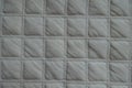 Thick white quilted fabric with crossing seams