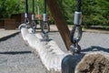 Thick white rope suspended from black ropes by brackets. Royalty Free Stock Photo