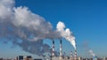 Thick white smoke, the release of toxic substances. Factory pipes polluting the air, environmental problems ecology, panoramic Royalty Free Stock Photo