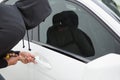 Thief breaking into car with screwdriver Royalty Free Stock Photo