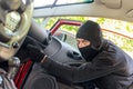 Thief breaks the door in the car Royalty Free Stock Photo