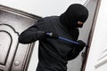 Thief burglar at house breaking Royalty Free Stock Photo