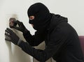 Thief burglar at house code breaking Royalty Free Stock Photo