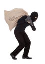 Thief carrying a large bag of money Royalty Free Stock Photo