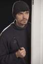 Thief with crowbar Royalty Free Stock Photo