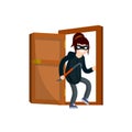 Thief with crowbar. Masked woman robber in black clothes broke down door of house.