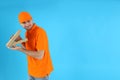 Thief delivery man with pizza on blue background