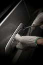 Thief with glove trying to open a vehicle door by driv Royalty Free Stock Photo