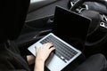 Thief hacking car system with laptop inside vehicle, closeup Royalty Free Stock Photo