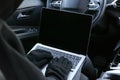 Thief hacking car system with laptop inside vehicle, closeup Royalty Free Stock Photo
