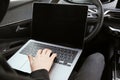 Thief hacking car system with laptop inside vehicle, closeup Royalty Free Stock Photo