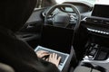 Thief hacking car system with laptop inside vehicle, closeup Royalty Free Stock Photo