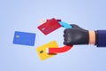 Thief hand with magnet and credit cards