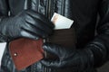 Thief hand wallet with money Royalty Free Stock Photo