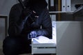 Thief Stealing Document From Drawer Royalty Free Stock Photo