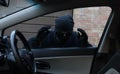 Thief looking in through a car window Royalty Free Stock Photo