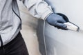 The thief pull up the door handle to Stealing a car. The vehicle insurance concept Royalty Free Stock Photo