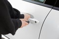 Thief with screwdriver breaking into car, closeup Royalty Free Stock Photo