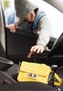 Thief stealing bag from the car Royalty Free Stock Photo