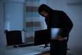 Thief Stealing Computer And Laptop Royalty Free Stock Photo