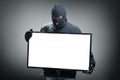Thief stealing computer monitor Royalty Free Stock Photo
