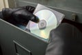 Thief stealing documents in compact disc Royalty Free Stock Photo