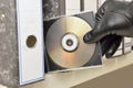 Thief stealing documents in compact disc Royalty Free Stock Photo