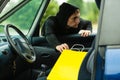 Thief stealing shopping bag from the car Royalty Free Stock Photo